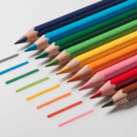 Seven pencil lead grades from 4H to 6B arranged in a diagonal row on a white surface